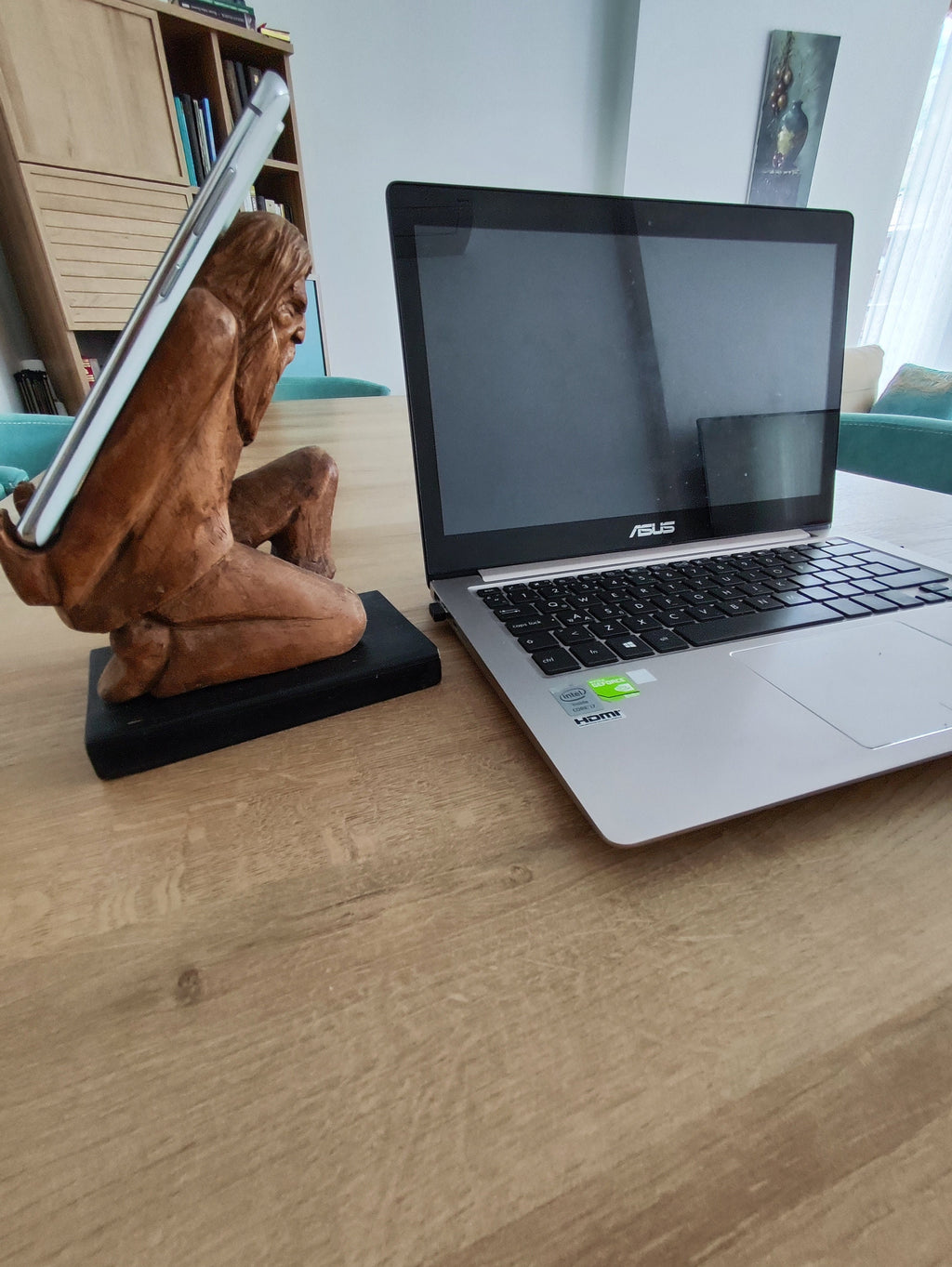 The Burden on Technology's Shoulders: Wooden Elder and Smartphone Stand