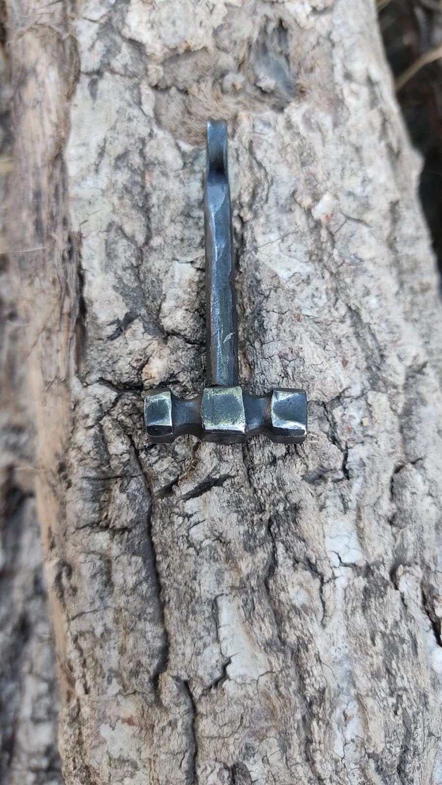 Handcrafted Steel Necklaces with Hammered Hammer Figures: Forging Hot Iron Using Traditional Techniques