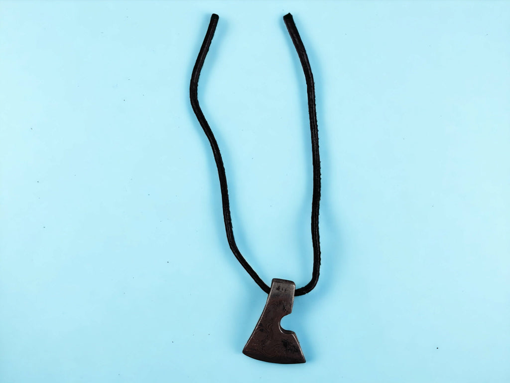 Handcrafted Steel Necklaces with Hammered Ax Figures: Forging Hot Iron Using Traditional Techniques