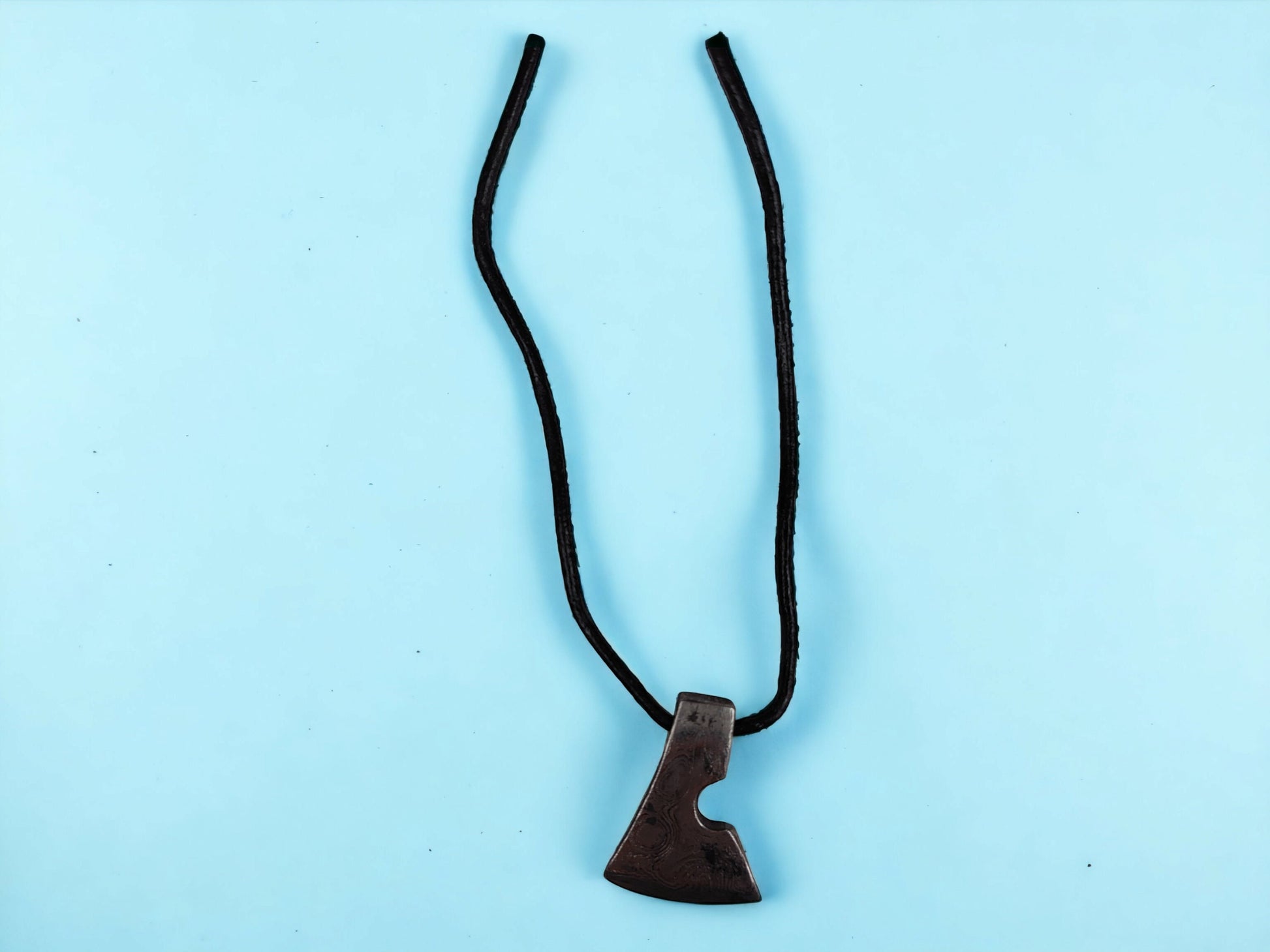 Handcrafted Steel Necklaces with Hammered Ax Figures: Forging Hot Iron Using Traditional Techniques