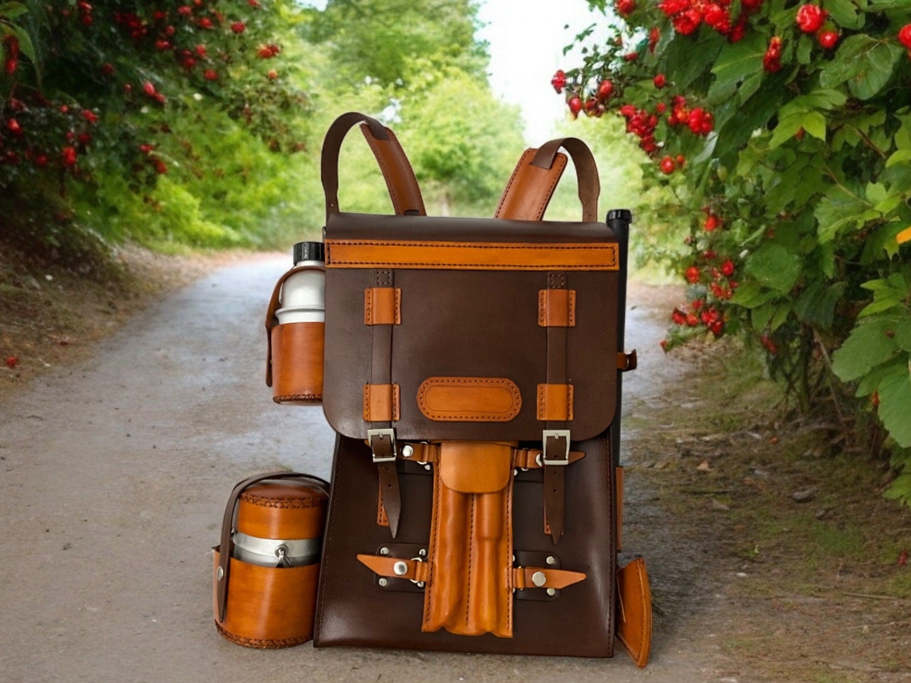 Handmade leather bushcraft bag a bushcraft axe, handmade folding pan, aluminum water carrier, camping pot, bushcraft drill, and bowsaw
