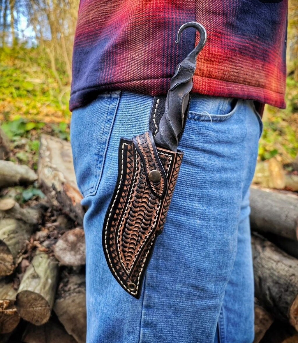 Blacksmith hand forged primitive style custom carbon steel knife with leather sheath